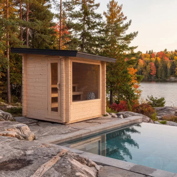 Canadian Timber Avalon 8' x 8' outdoor cedar sauna beside a pool with autumn foliage and a lake behind