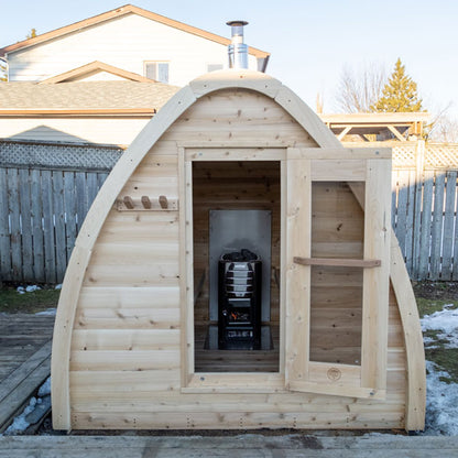 MiniPOD interior with wood-burning heater and cedar bench