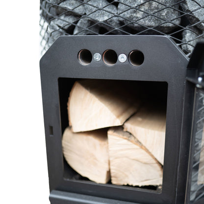 Cozy Heat O 18kW through-wall wood-burning sauna stove loaded with stones